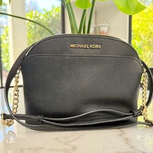 Like new Michael Kors black crossbody bag with gold details